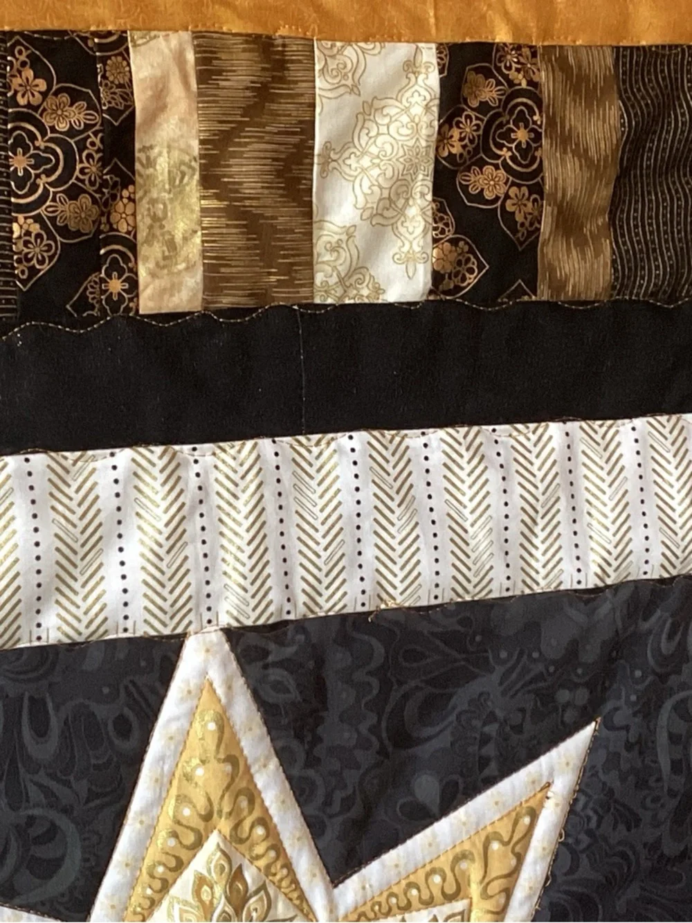 NWT. Gold and Black Star Lap Quilt
